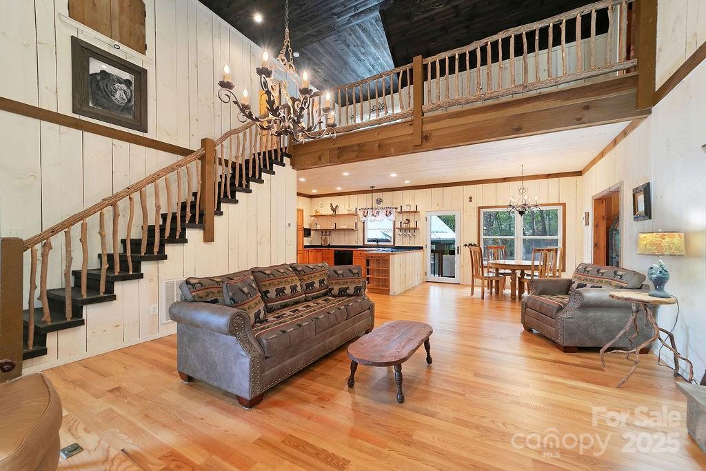 418 Sandy Lane Brevard, NC 28712 - Photo 19 of 45 a living room with fireplace furniture and a chandelier