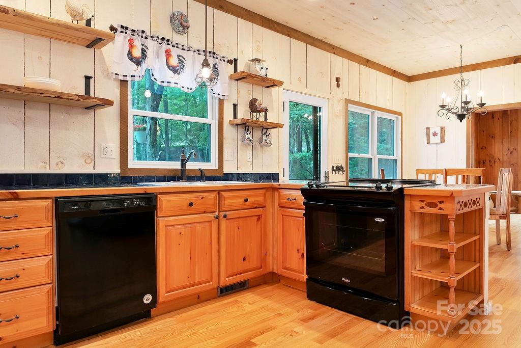 418 Sandy Lane Brevard, NC 28712 - Photo 21 of 45 a kitchen with stainless steel appliances granite countertop a stove and a sink