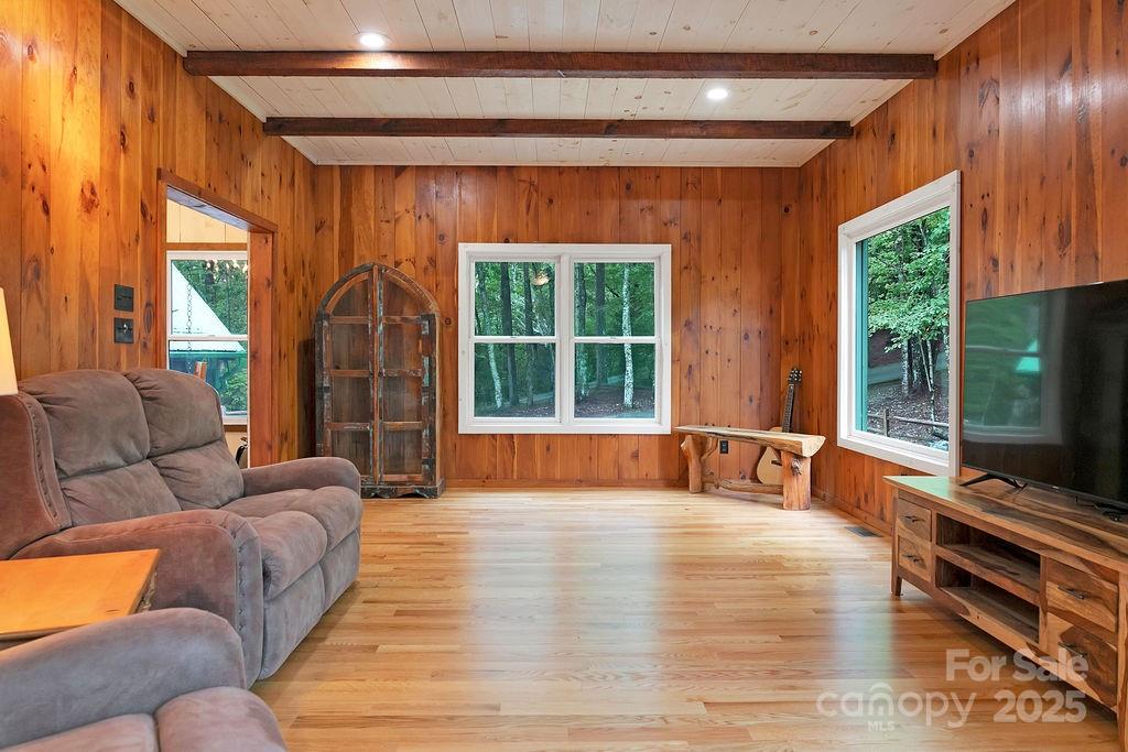 418 Sandy Lane Brevard, NC 28712 - Photo 27 of 45 a living room with furniture and a flat screen tv
