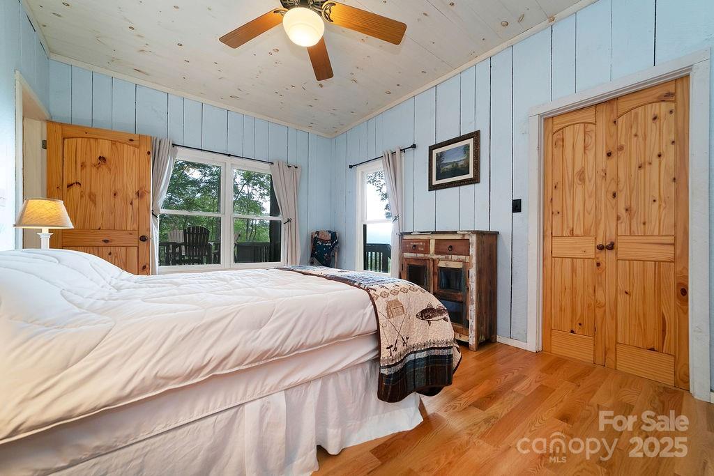418 Sandy Lane Brevard, NC 28712 - Photo 29 of 45 a bed sitting in a spacious bedroom next to a window