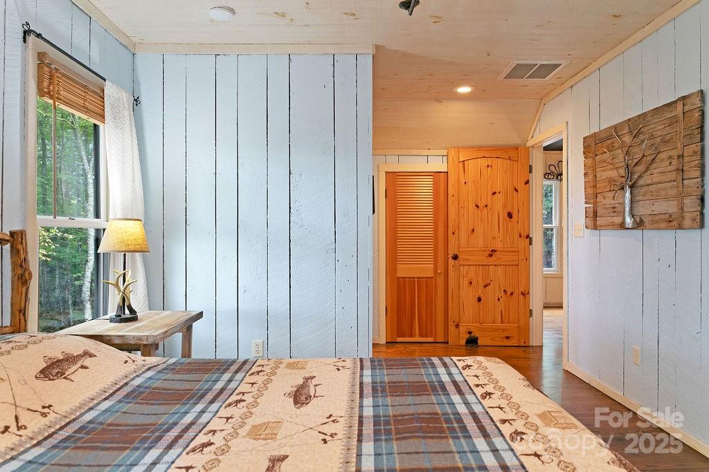 418 Sandy Lane Brevard, NC 28712 - Photo 34 of 45 a bedroom with a bed and a window