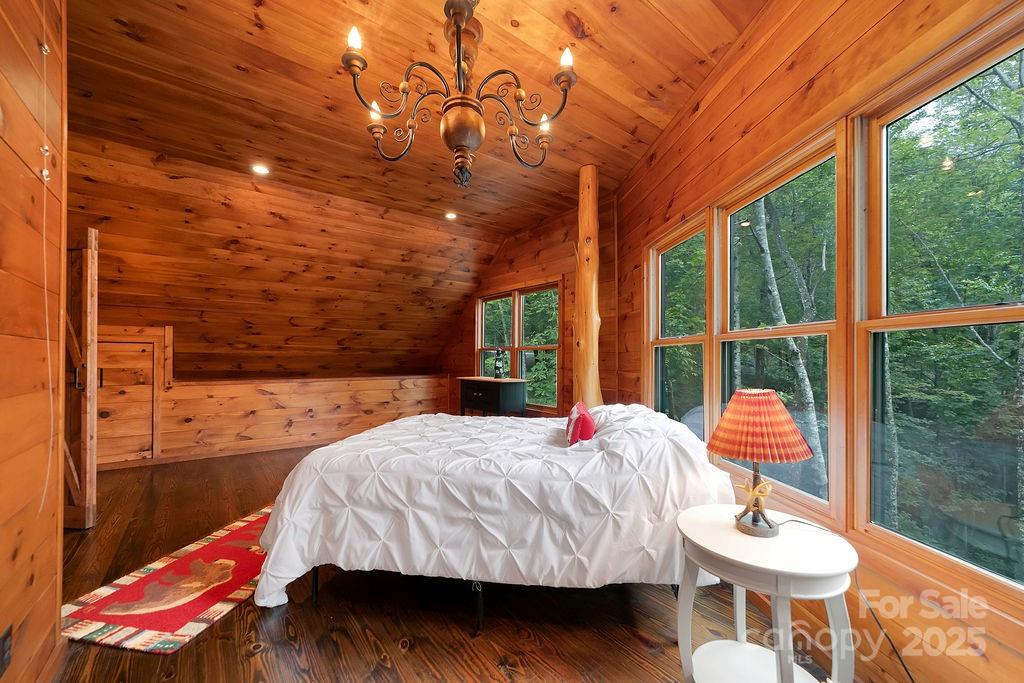 418 Sandy Lane Brevard, NC 28712 - Photo 41 of 45 a bedroom with a bed and a window