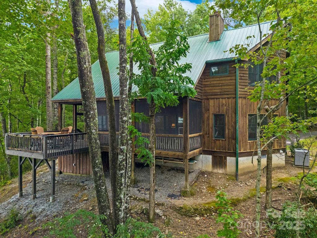 418 Sandy Lane Brevard, NC 28712 - Photo 45 of 45 a backyard of a house with table and chairs