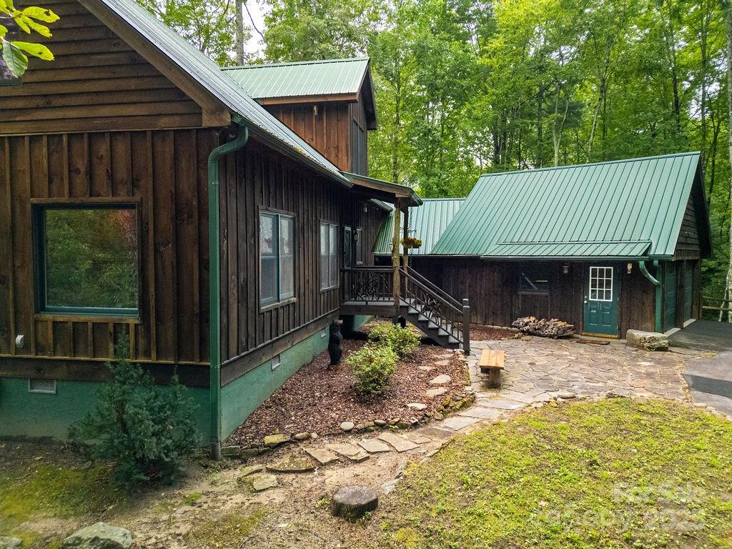 418 Sandy Lane Brevard, NC 28712 - Photo 6 of 45 a backyard of a house with yard and outdoor seating