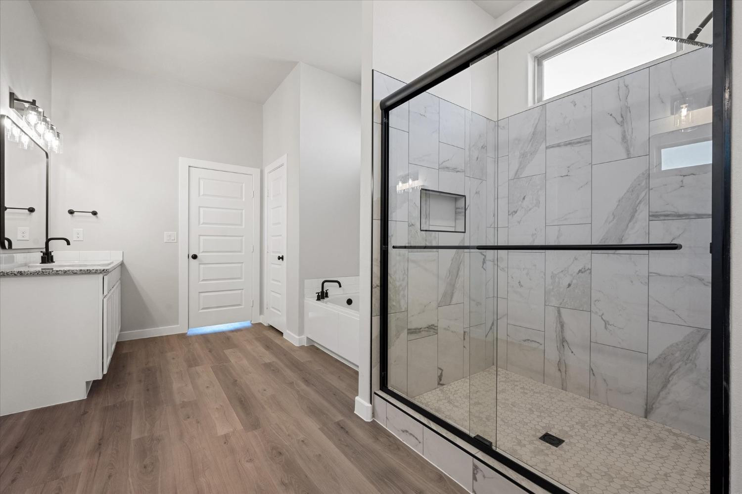 7426 30th Street Lubbock, TX 79407 - Photo 16 of 25 a bathroom with a shower