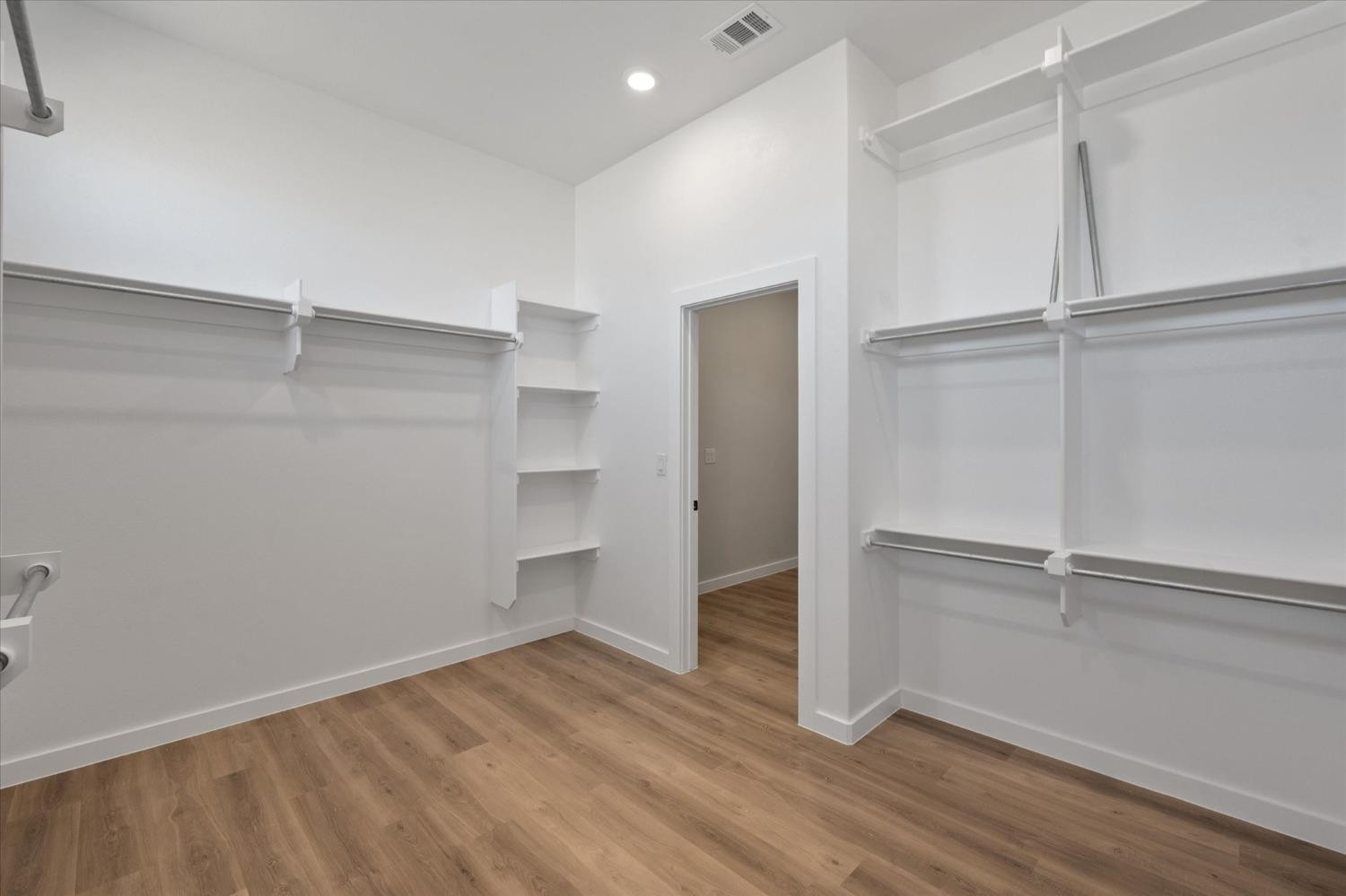 7426 30th Street Lubbock, TX 79407 - Photo 18 of 25 a view of an empty room with wooden floor