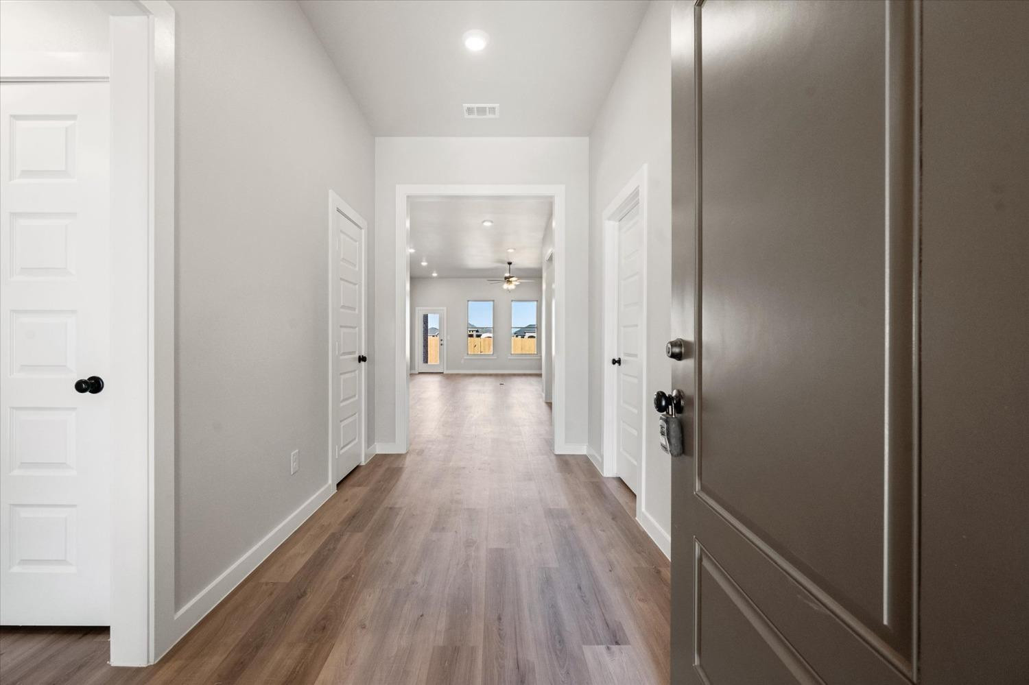 7426 30th Street Lubbock, TX 79407 - Photo 2 of 25 a view of a hallway with wooden floor