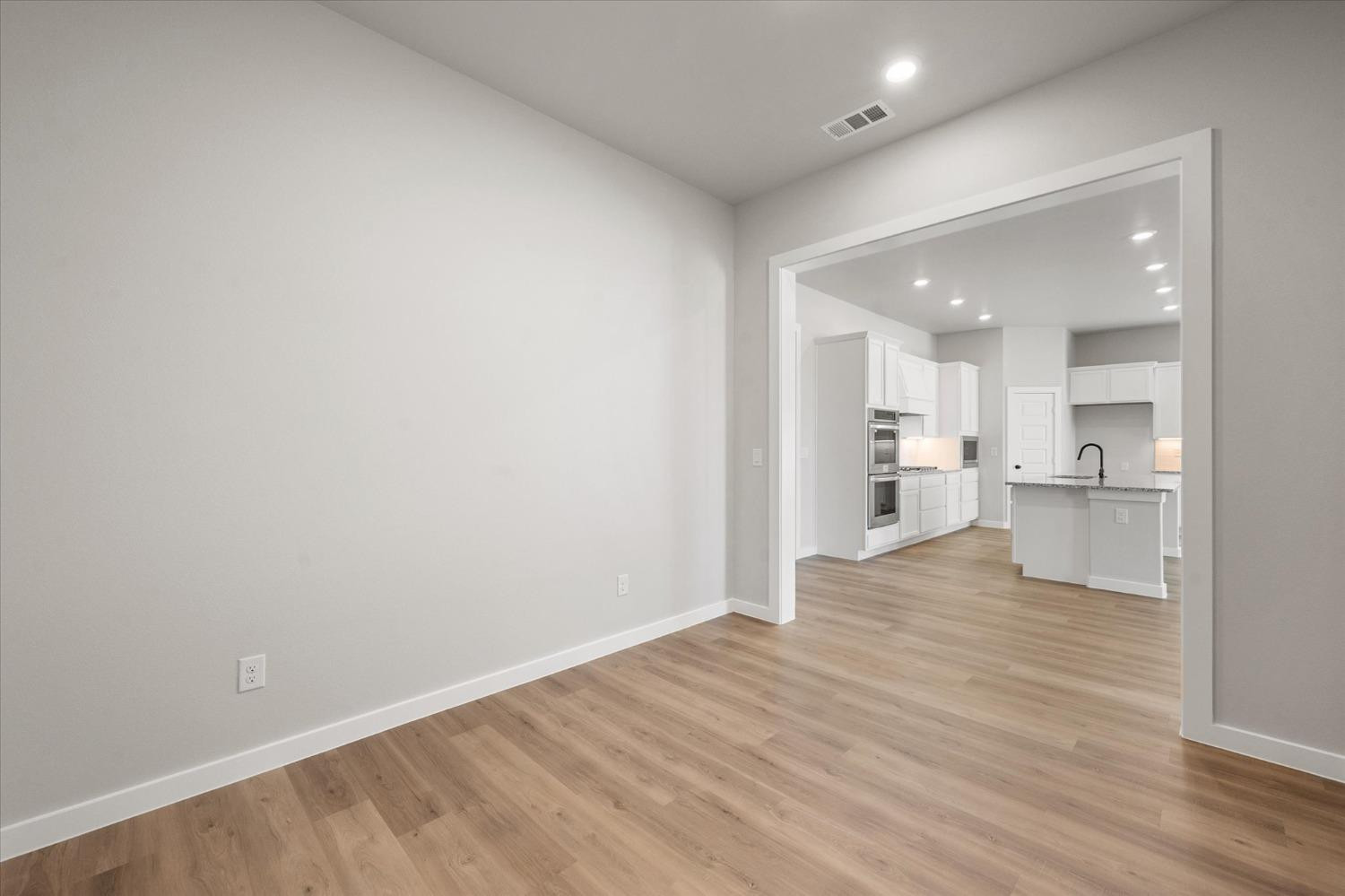 7426 30th Street Lubbock, TX 79407 - Photo 8 of 25 a view of kitchen with wooden floor