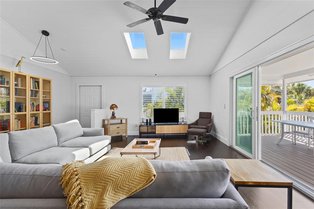 315 Spring Avenue Anna Maria, FL 34216 - Photo 10 of 63 a living room with furniture ceiling fan and a window