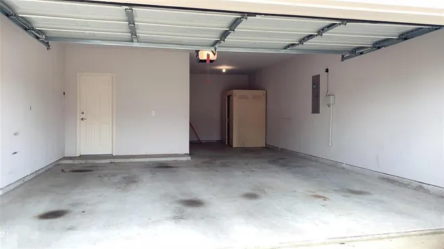 a view of a backyard with wooden fence