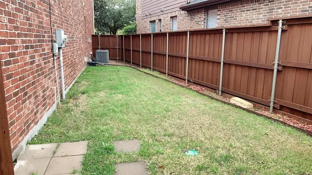a view of a backyard with a tree