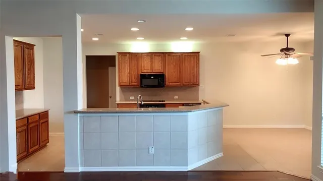 a kitchen with a stove and a microwave
