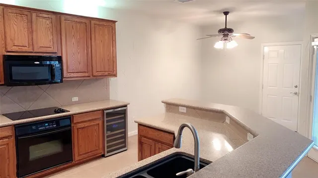 a kitchen with a sink and a window
