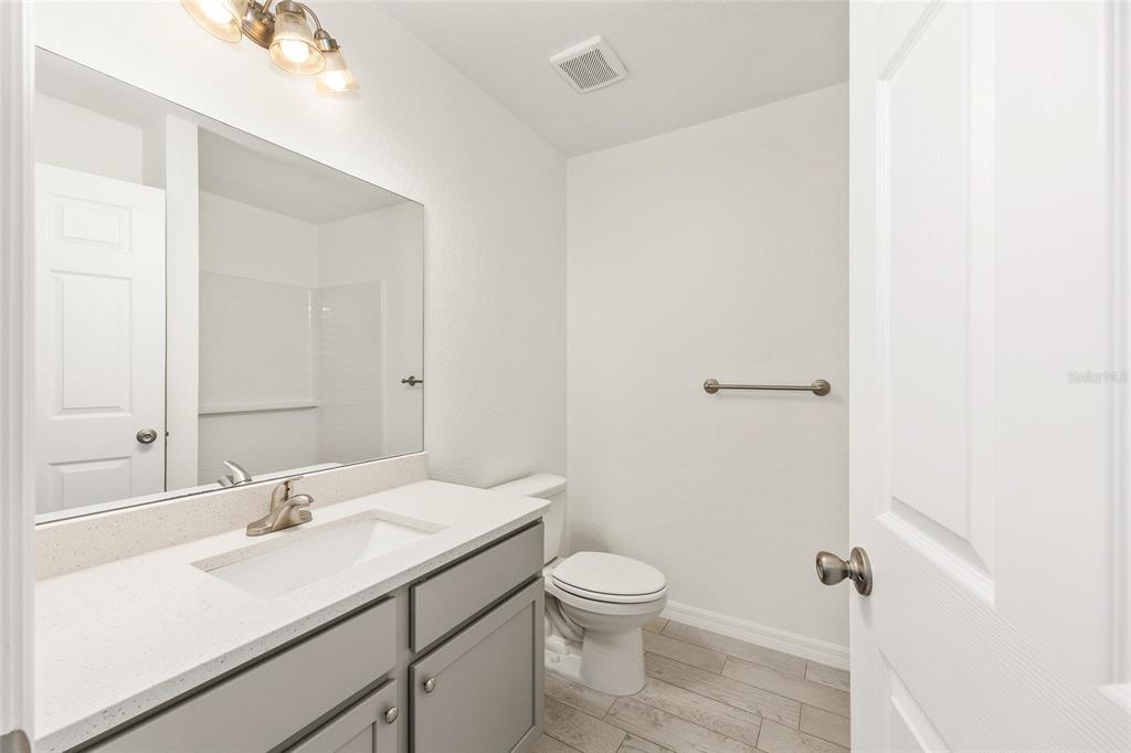 229 Locust Lane Ocala, FL 34472 - Photo 20 of 28 a bathroom with a sink toilet and shower