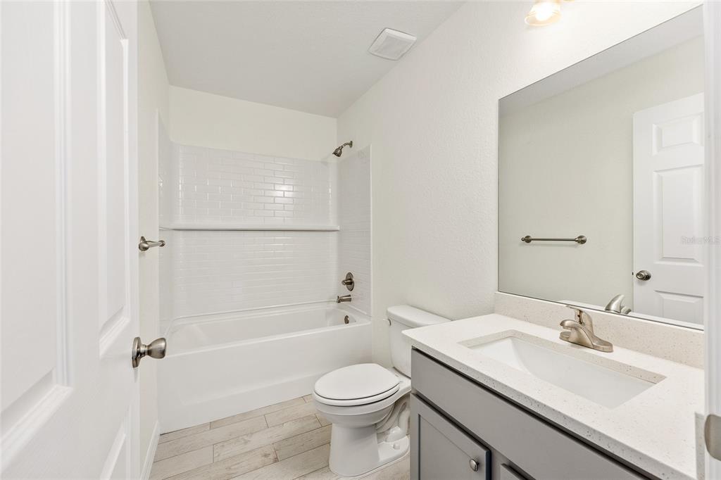 229 Locust Lane Ocala, FL 34472 - Photo 24 of 28 a bathroom with a sink toilet vanity and shower