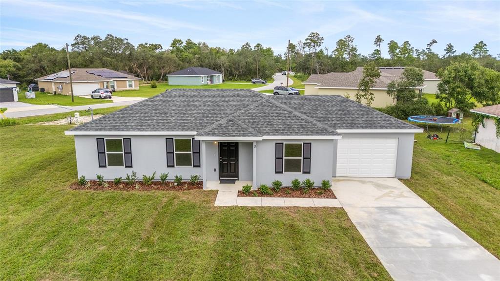 229 Locust Lane Ocala, FL 34472 - Photo 3 of 28 a front view of house with yard outdoor seating and green space