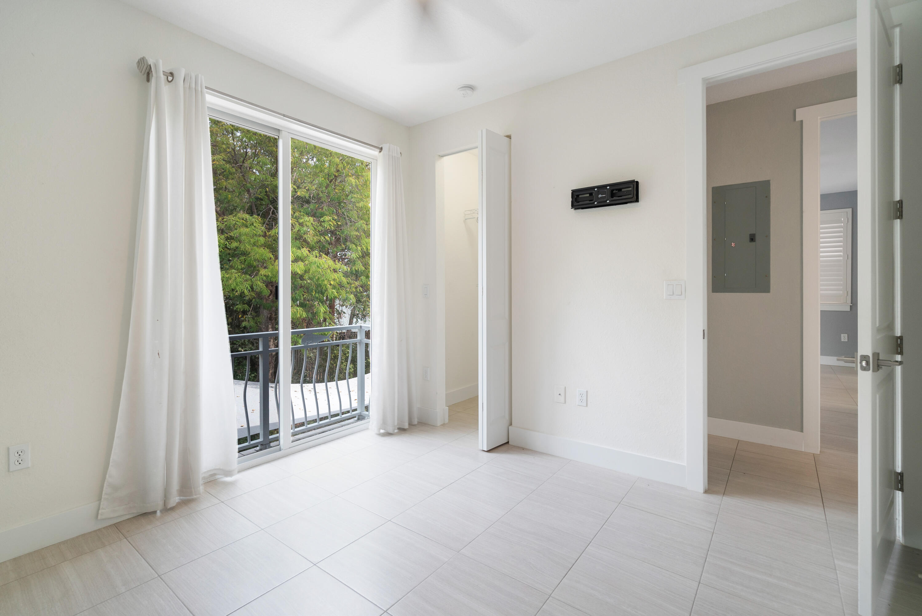 582 Boyd Drive Key Largo, FL 33037 - Photo 14 of 36 a view of a room with sliding glass door and glass doors