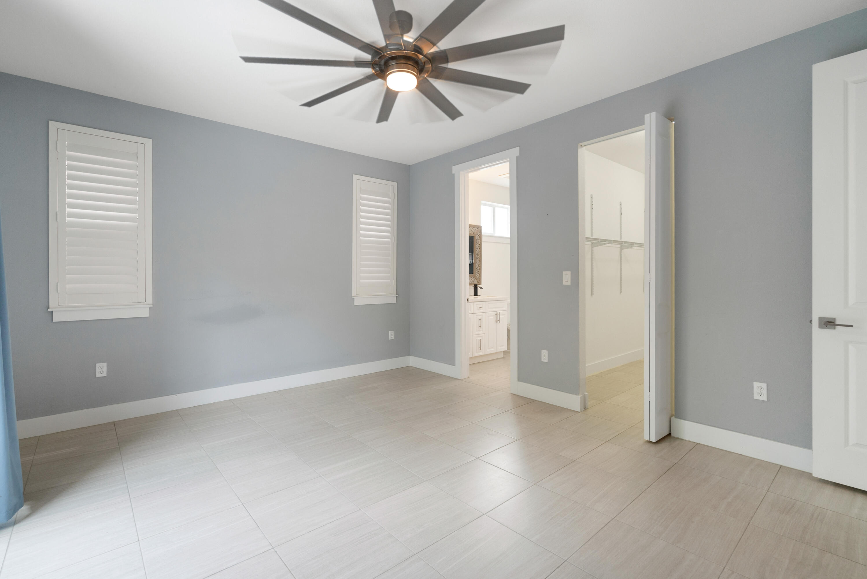 582 Boyd Drive Key Largo, FL 33037 - Photo 15 of 36 wooden floor in an empty room with a window
