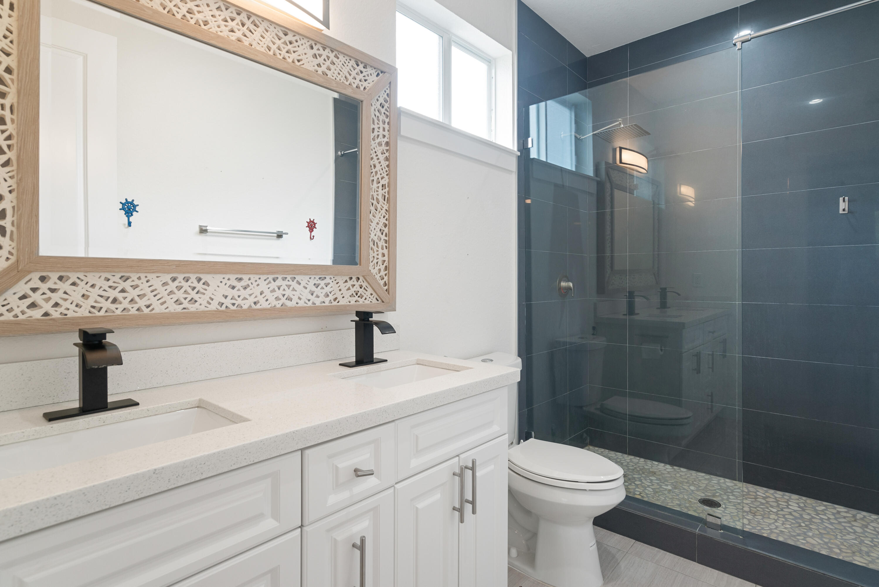 582 Boyd Drive Key Largo, FL 33037 - Photo 19 of 36 a bathroom with a sink a toilet and shower