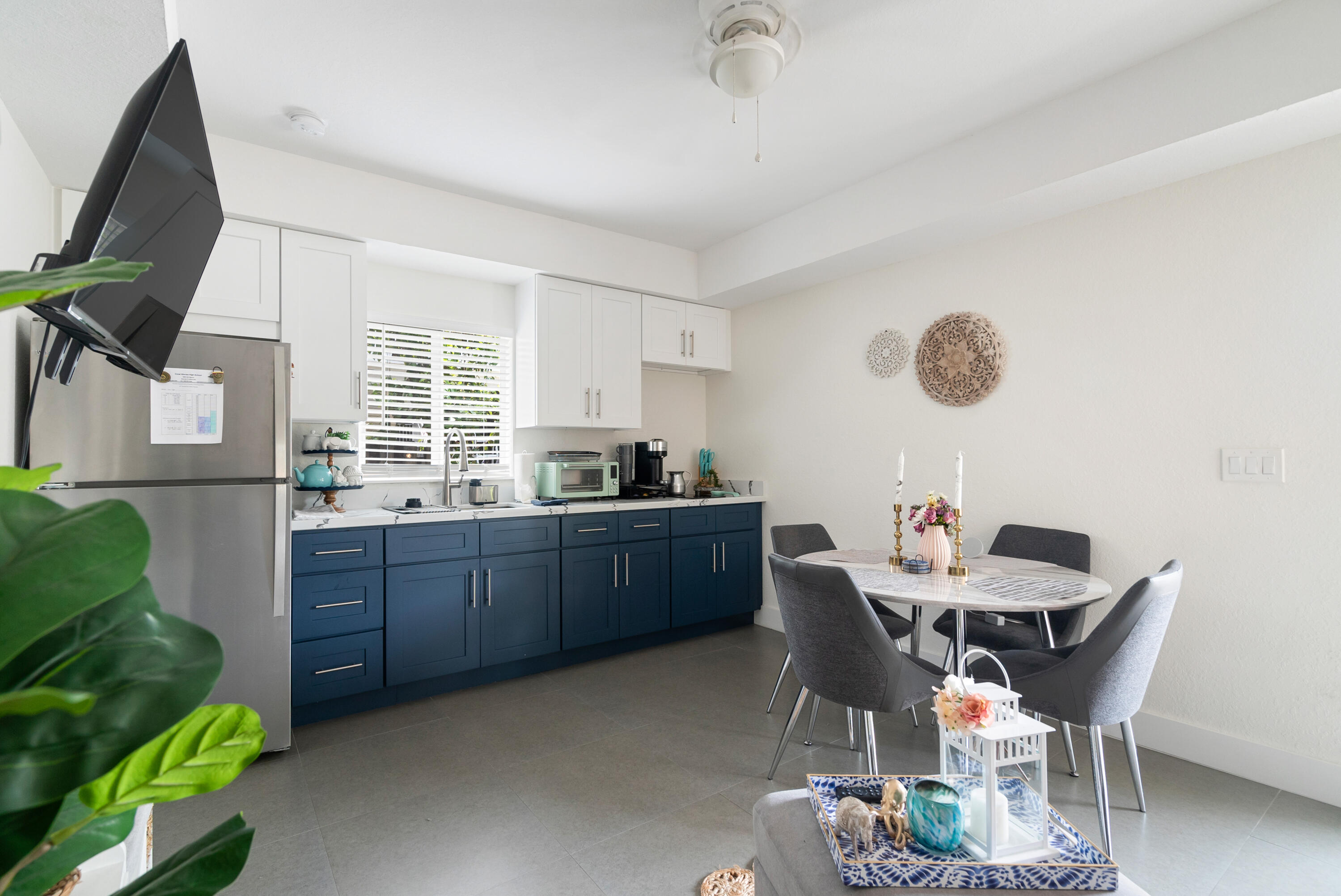 582 Boyd Drive Key Largo, FL 33037 - Photo 23 of 36 a kitchen with a table and chairs in it