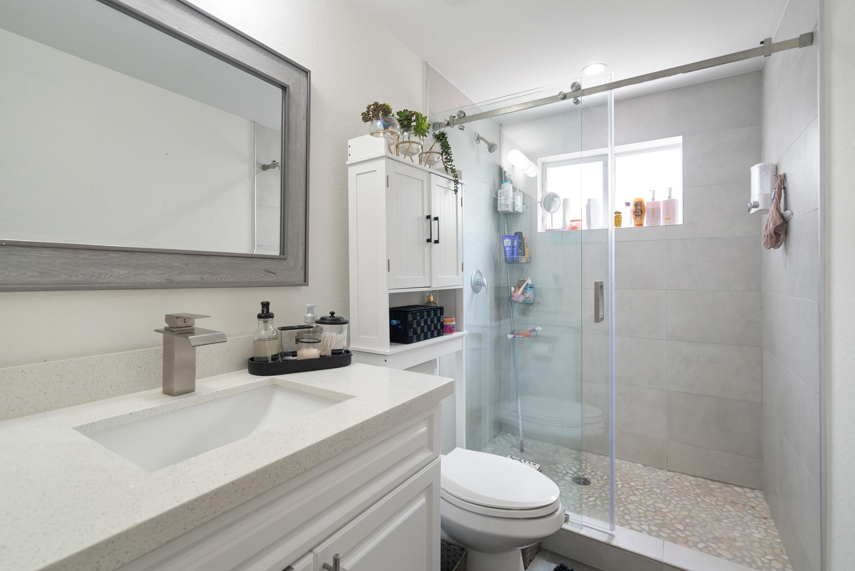 582 Boyd Drive Key Largo, FL 33037 - Photo 25 of 36 a bathroom with a sink a toilet and shower