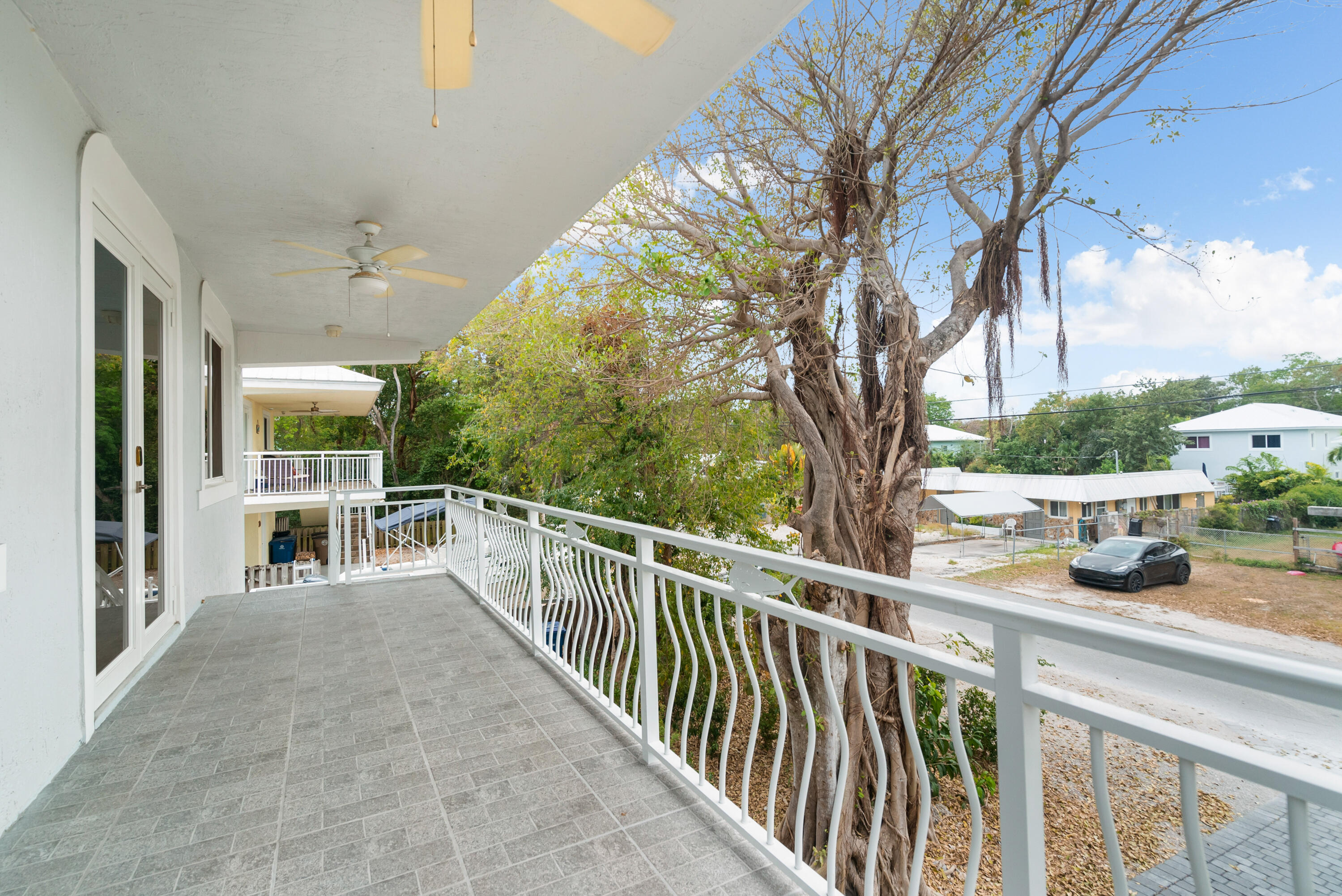 582 Boyd Drive Key Largo, FL 33037 - Photo 30 of 36 a view of a balcony with chairs