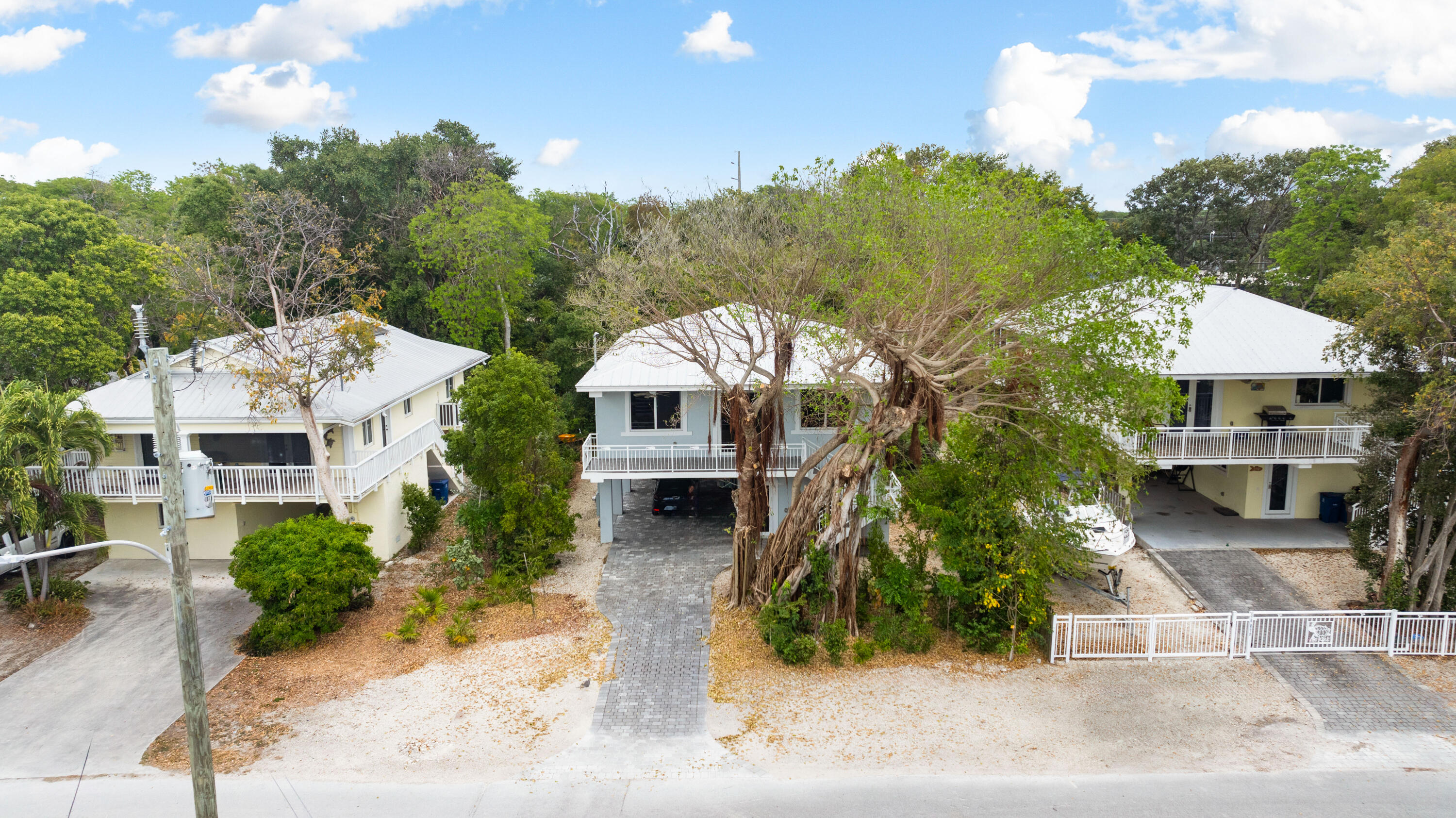 582 Boyd Drive Key Largo, FL 33037 - Photo 33 of 36 a aerial view of a house with yard and sitting area