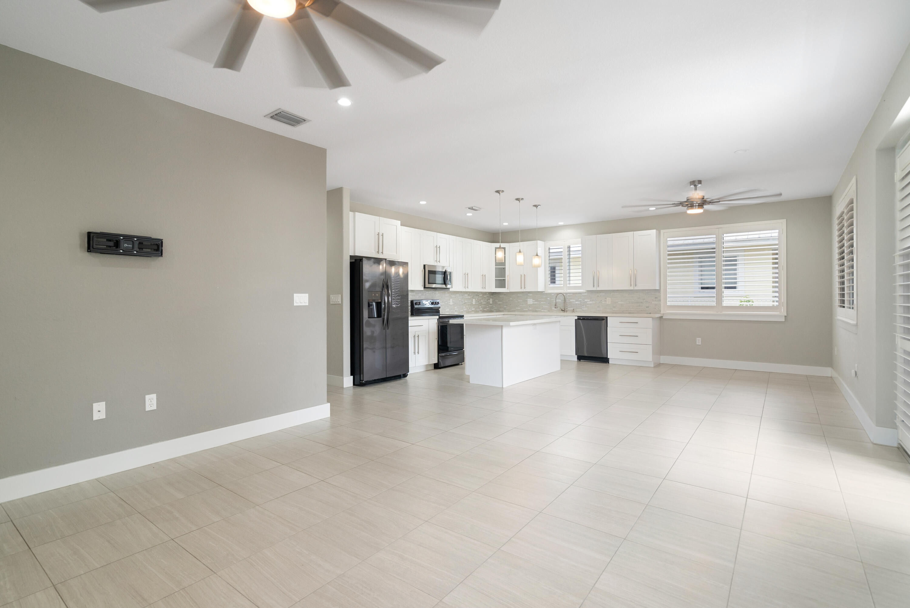 582 Boyd Drive Key Largo, FL 33037 - Photo 6 of 36 a view of a kitchen with a sink and a refrigerator