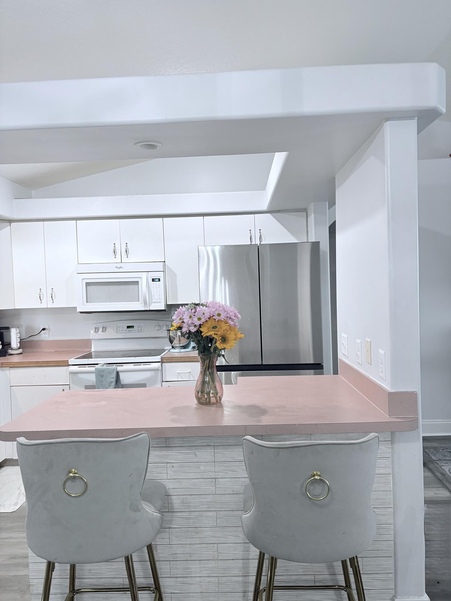 462 Southeast Cork Road Port St. Lucie, FL 34984 - Photo 17 of 57 a kitchen with a sink cabinets and stove top oven