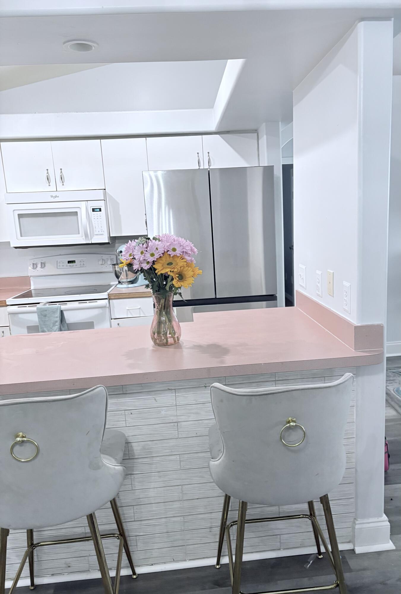 462 Southeast Cork Road Port St. Lucie, FL 34984 - Photo 18 of 57 a room with a sink and a table