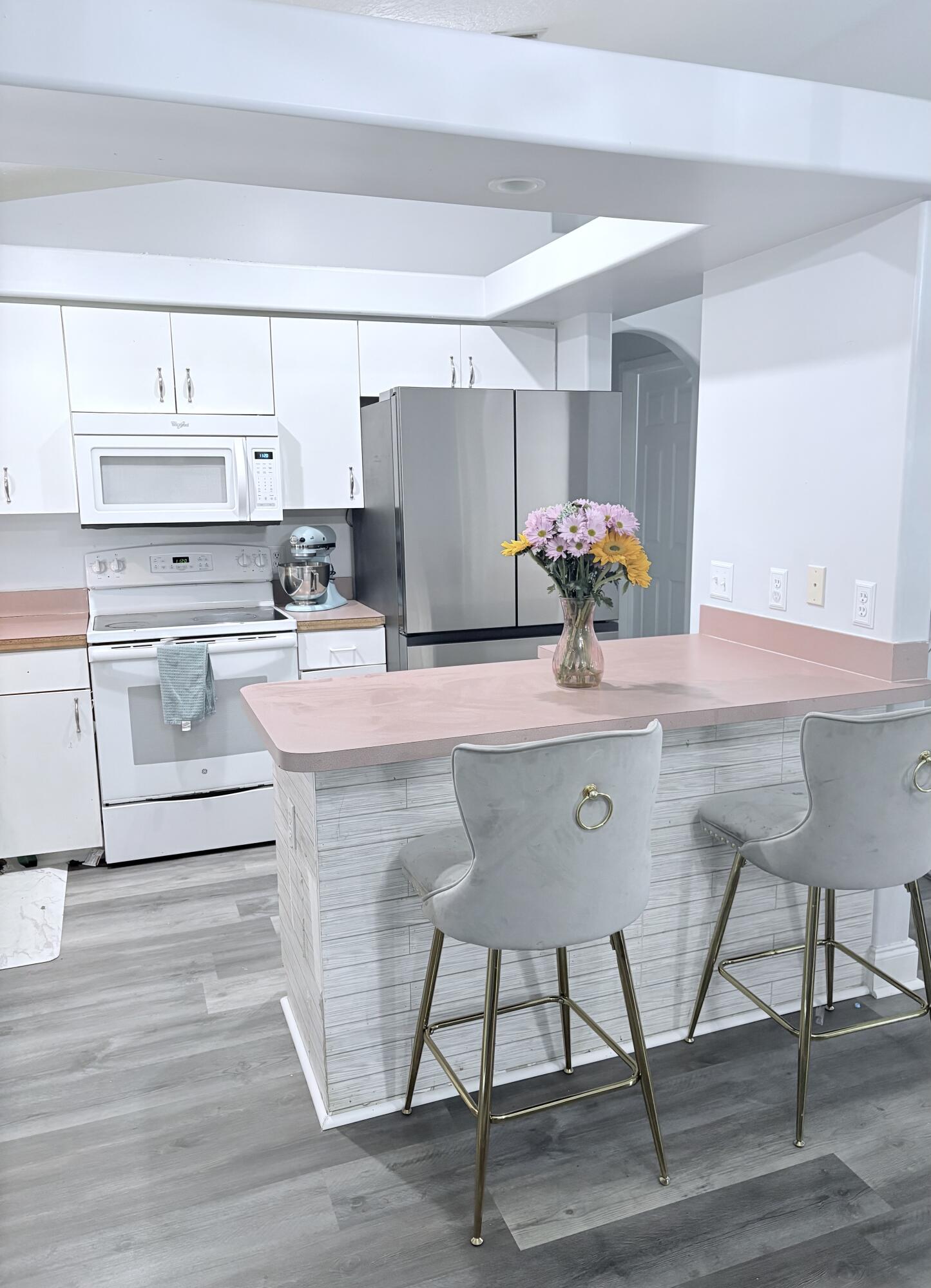 462 Southeast Cork Road Port St. Lucie, FL 34984 - Photo 20 of 57 a kitchen with a sink cabinets and appliances