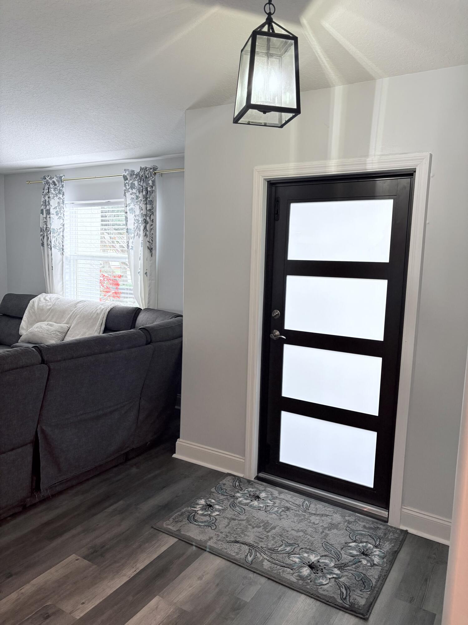 462 Southeast Cork Road Port St. Lucie, FL 34984 - Photo 35 of 57 a living room with furniture and a window