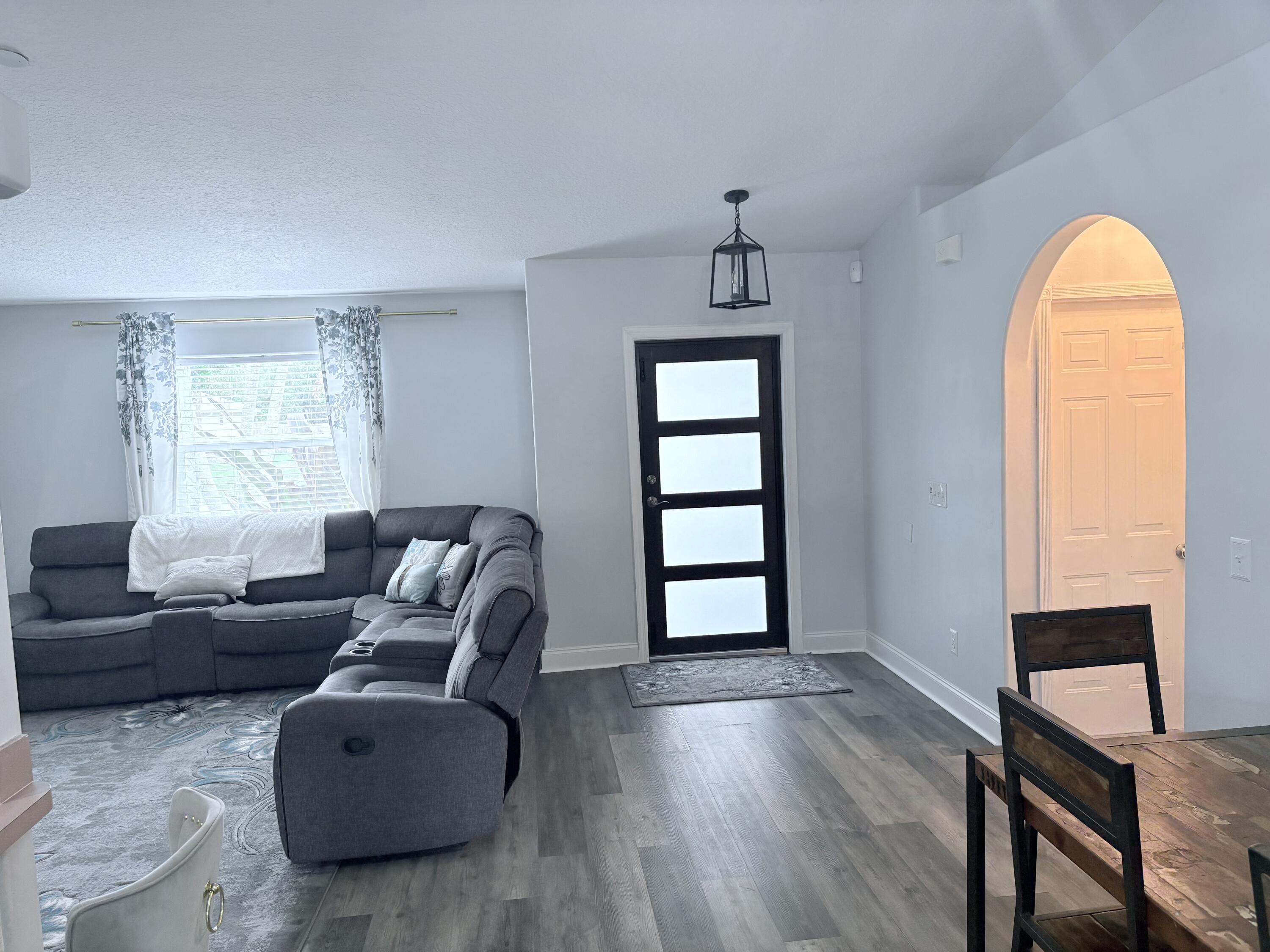 462 Southeast Cork Road Port St. Lucie, FL 34984 - Photo 36 of 57 a living room with furniture and a window