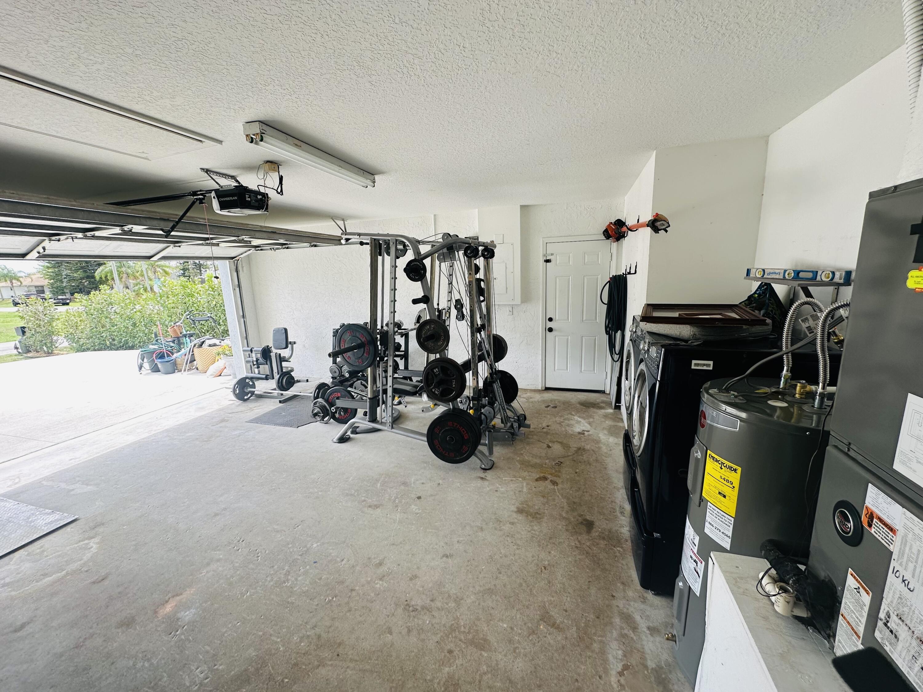 462 Southeast Cork Road Port St. Lucie, FL 34984 - Photo 42 of 57 a view of a room with gym equipment