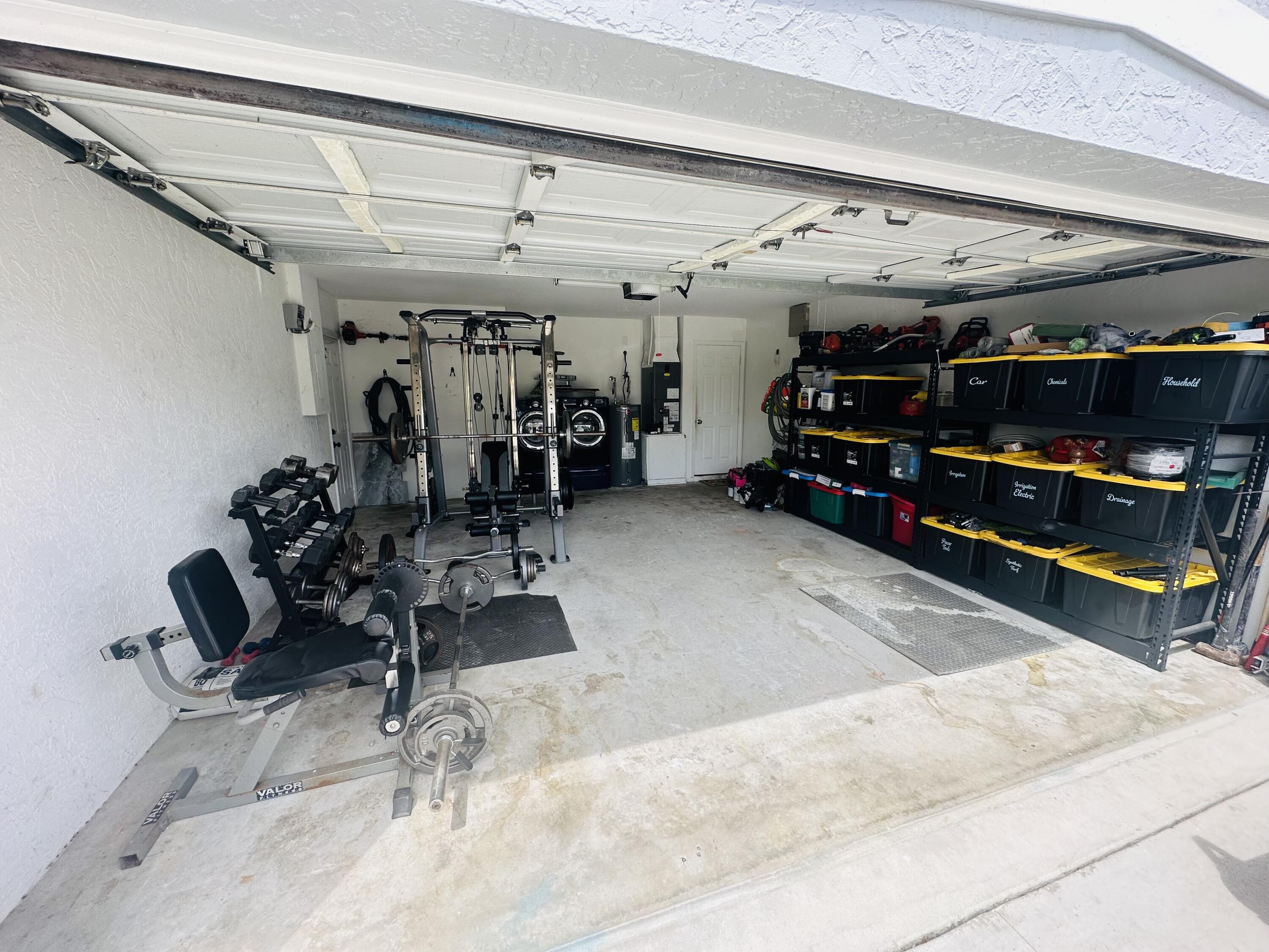 462 Southeast Cork Road Port St. Lucie, FL 34984 - Photo 44 of 57 a view of a room with gym equipment