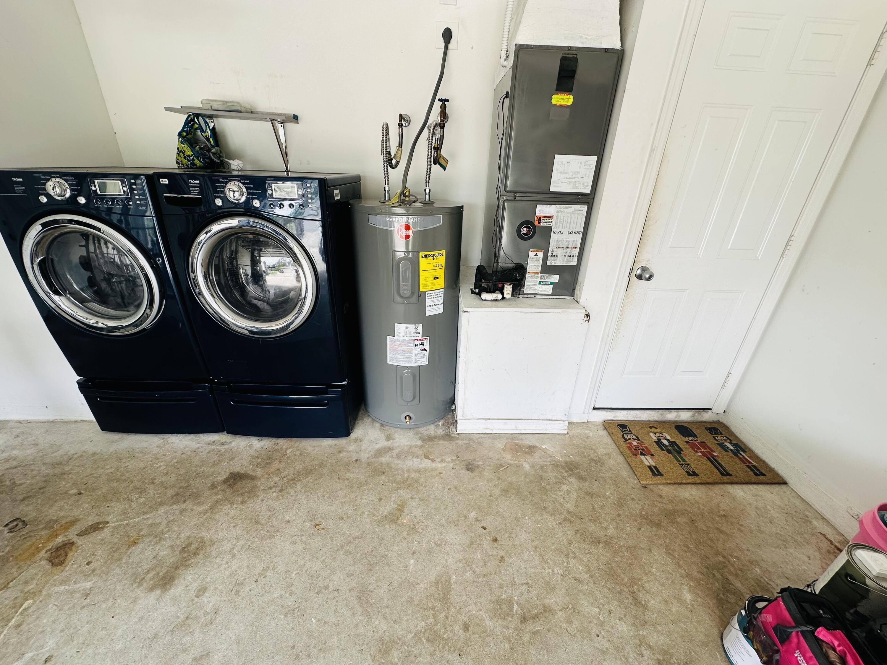462 Southeast Cork Road Port St. Lucie, FL 34984 - Photo 46 of 57 a utility room with dryer and washer