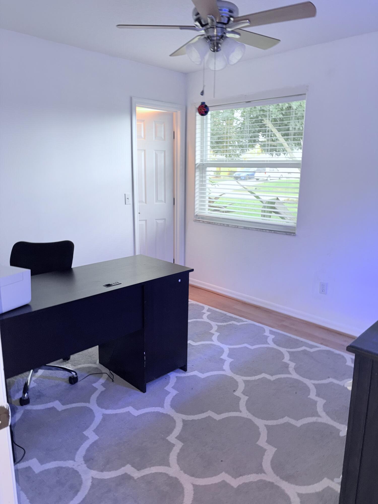 462 Southeast Cork Road Port St. Lucie, FL 34984 - Photo 50 of 57 a room with a bed and a window