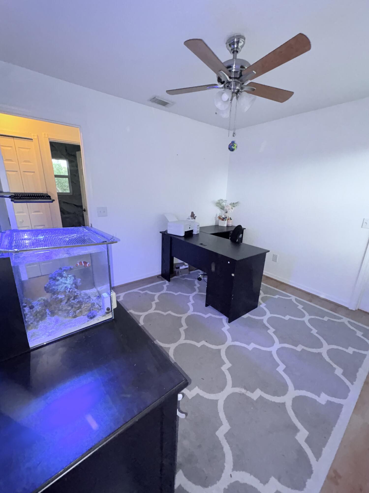 462 Southeast Cork Road Port St. Lucie, FL 34984 - Photo 51 of 57 a living room with furniture and wooden floor