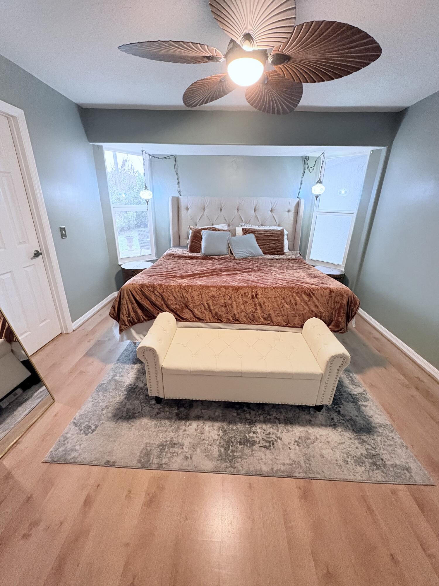 462 Southeast Cork Road Port St. Lucie, FL 34984 - Photo 56 of 57 a bed sitting in a bedroom next to a window