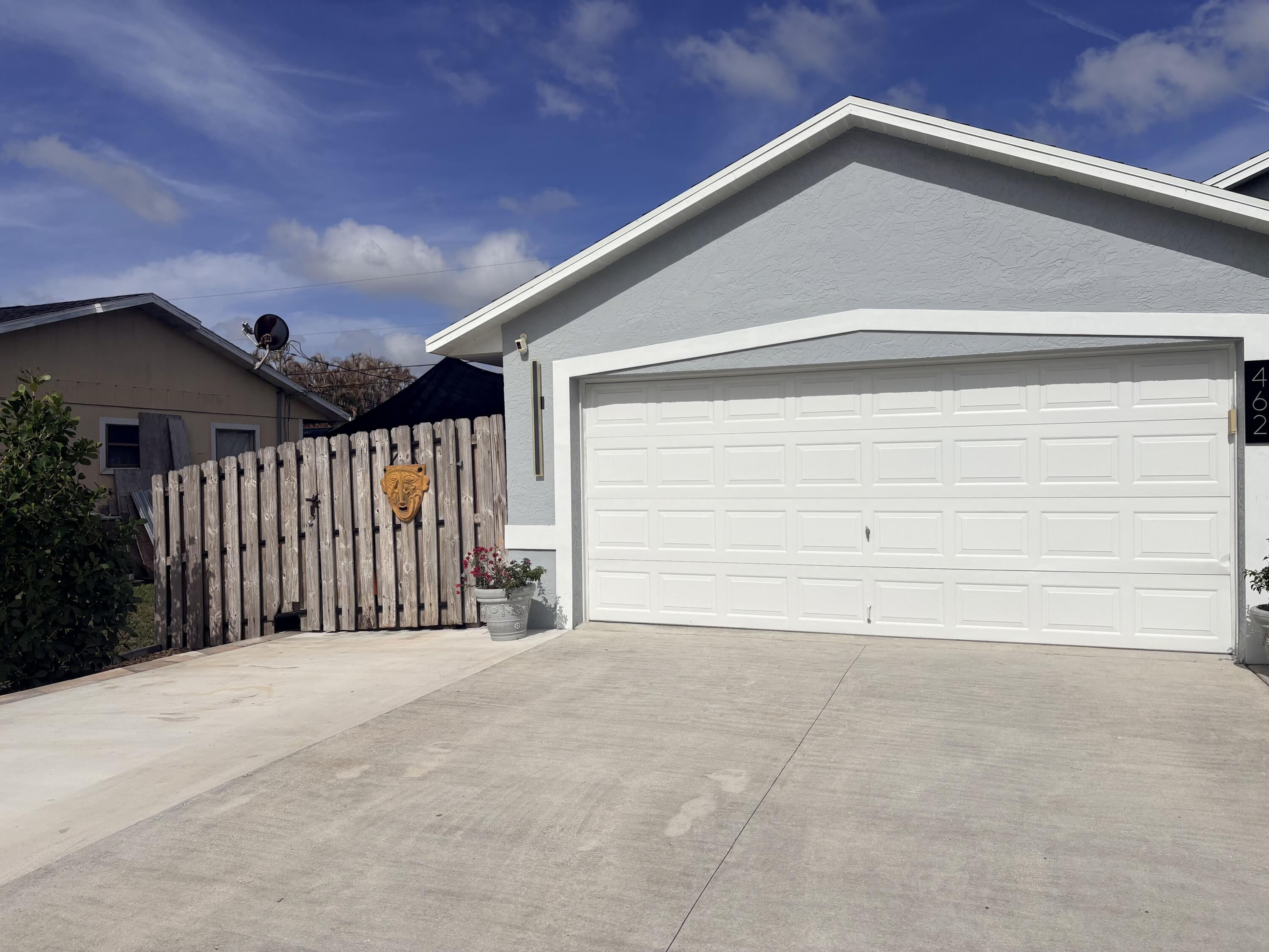 462 Southeast Cork Road Port St. Lucie, FL 34984 - Photo 7 of 57 a view of a garage