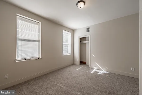 an empty room with windows