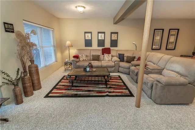 a living room with furniture and a rug