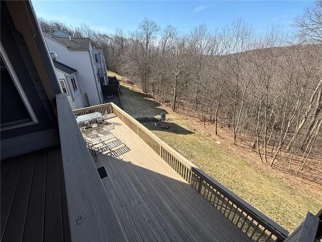 a view of swimming pool from a balcony