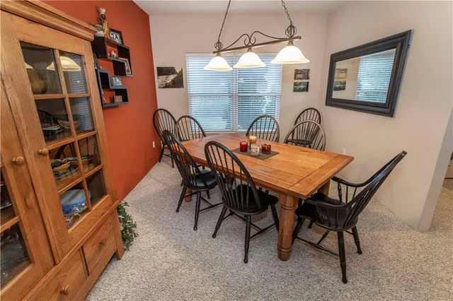 a view of a dining room that has a table and chairs