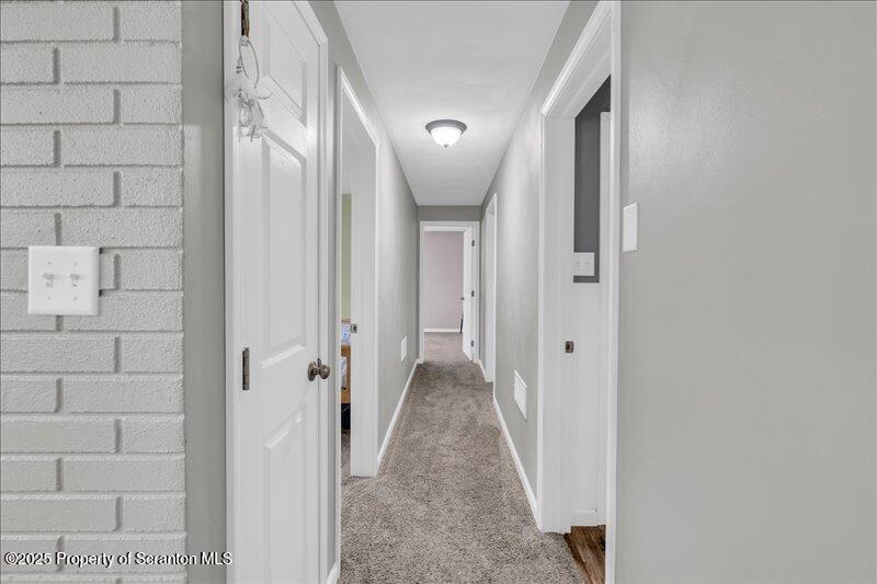 895 Cemetery Road Little Meadows, PA 18830 - Photo 18 of 40 a view of a hallway with wooden floor and staircase