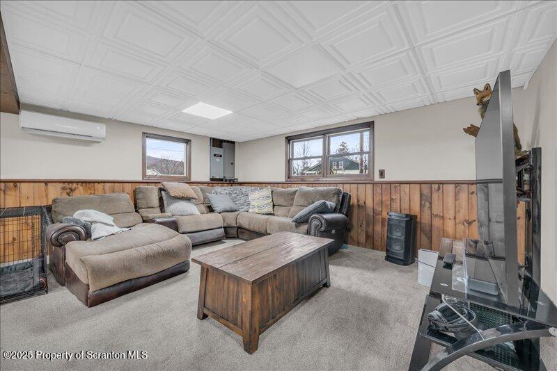 895 Cemetery Road Little Meadows, PA 18830 - Photo 28 of 40 a living room with furniture and a couch