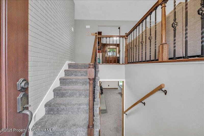 895 Cemetery Road Little Meadows, PA 18830 - Photo 9 of 40 a view of staircase with lots of frames on wall