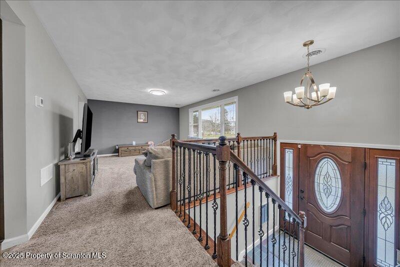 895 Cemetery Road Little Meadows, PA 18830 - Photo 10 of 40 a view of a livingroom with furniture pendant lights
