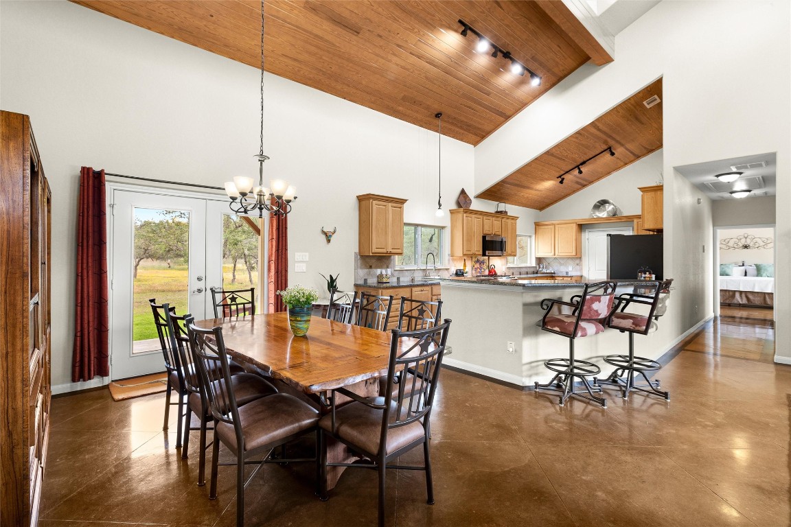 426 Preiss Ranch Road Blanco, TX 78606 - Photo 12 of 40 a dining room with furniture and wooden floor