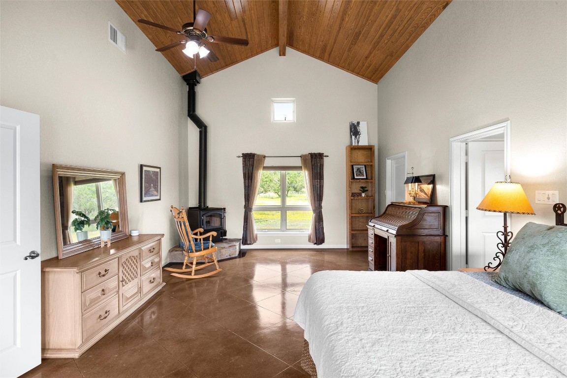 426 Preiss Ranch Road Blanco, TX 78606 - Photo 20 of 40 a bedroom with a bed and wooden floor